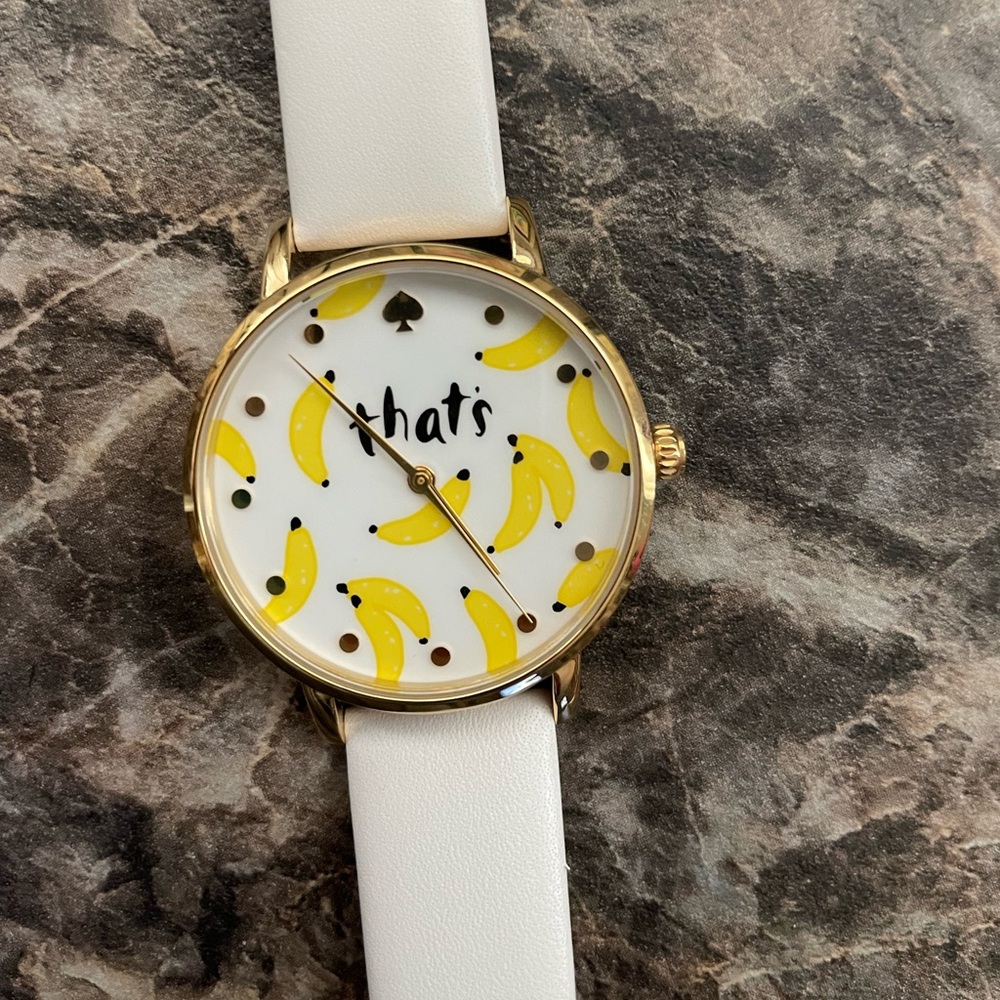 Kate Spade that’s bananas watch with white leather band.